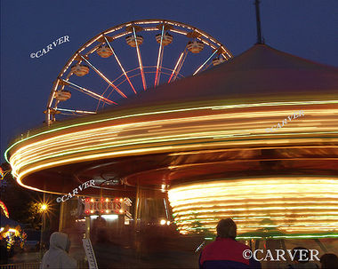 Moving in Circles
From the Topsfield Fair. A carousel turns in the foreground while a ferris wheel does the same.
Keywords: Topsfield Fair; ferris wheel; carousel; color; photograph; picture; print